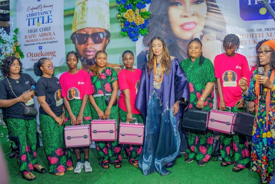 Judith presenting makeup kits to young women