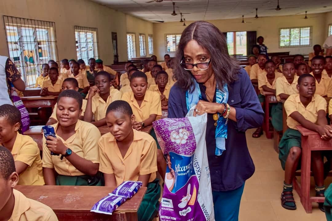 Judith donating sanitary pads